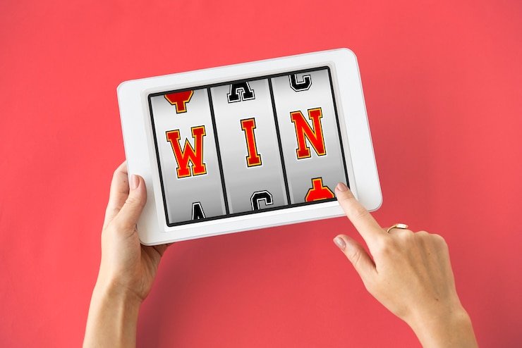Mobile device displaying sports betting interface and casino game options